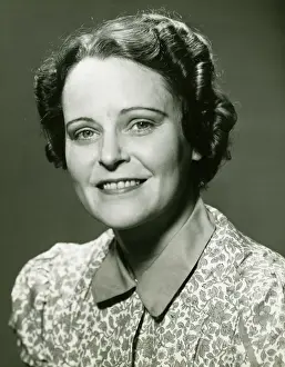 50 59 Years Prints: Smiling mature woman posing in studio, (B&W), portrait, close-up