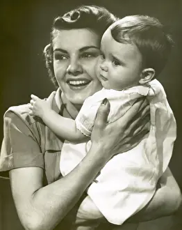 Smiling mother with baby