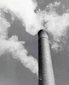 Pollution Prints: Smokestack Emitting Smoke Into Sky
