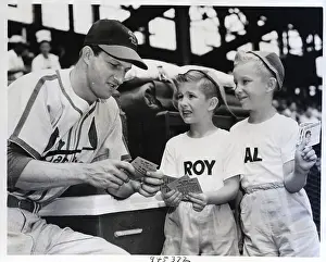 Stan Musial Prints: S.Musial & Twins Go Thru Some Pictures