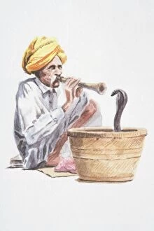 Indian Culture Gallery: Snake charmer playing flute-like instrument, snake emerging from basket in front