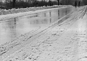Images Dated 5th August 2008: Snow-covered road in winter, with people in background
