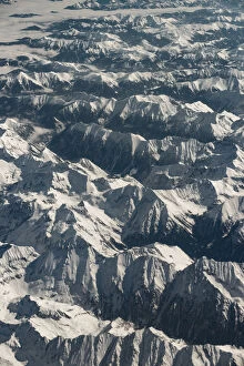 Snow mountain range view from a plane