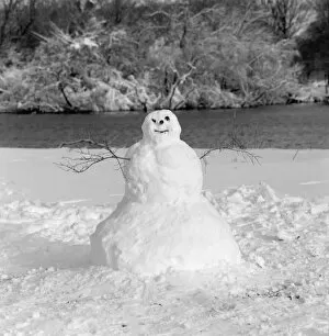 Wintry Gallery: Snowman in winter landscape