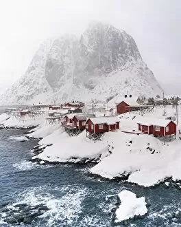 Images Dated 11th February 2019: Snowstorm, red stilt houses, Hamnoy, drone shot, Lofoten, Norway