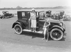 Socialite Couple Posing with Their Automobile
