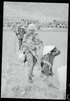 Soldier Aiding Children