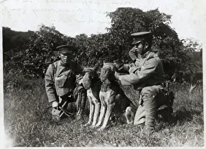 Soldier Attaching Muzzle To Dog