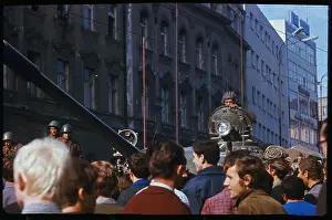 Soldier Driving a Tank Through a Crowd
