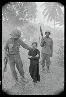 Soldier Escorting a Vietnamese Woman