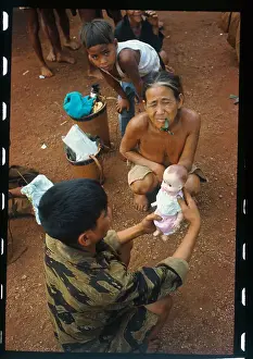 Pleiku Prints: Soldier Giving a Doll to a Youngster