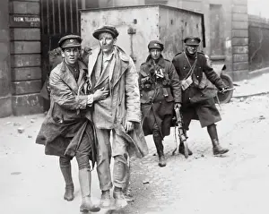 Soldier Helping an Injured Man