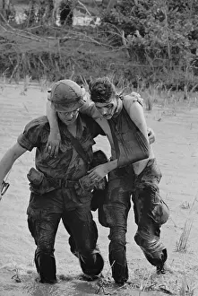 Soldier Helping Wounded Soldier to Safety