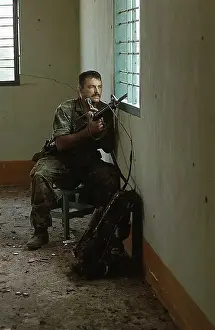 Soldier Holding Machine Gun