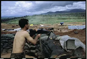 Soldier Holding Machine Gun at Post