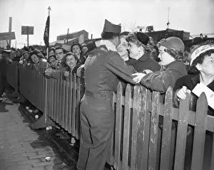Soldier Kissing Wife Over Fence