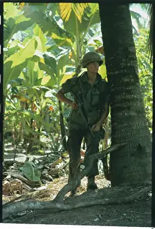 Soldier Leaning Against a Tree