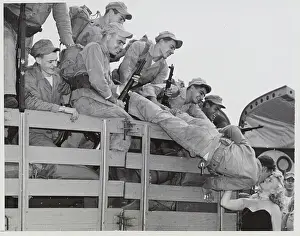 Soldier Leaning Over Truck to Kiss Lady