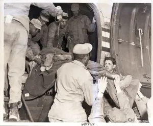 North Korea Prints: Soldier Being Lifted by Evacuation Plane