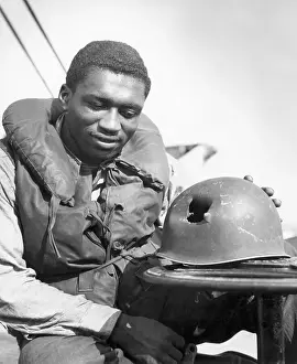 Hole Prints: Soldier Looks At Hole In Helmet