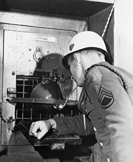 Soldier Peering into Goering's Cell