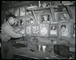 Soldier Putting Picture On Pinup Wall