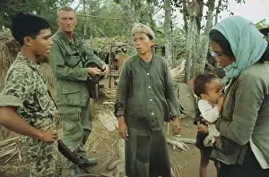 Soldier Questioning a Woman in Viet Cong Village