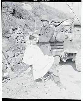US Soldier Receiving Haircut from Fellow GI