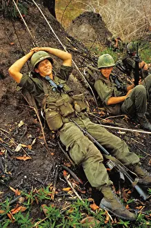Soldier Relaxing on Ground With Hands Over Head