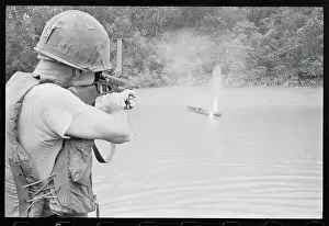 Soldier Shooting a Sampan