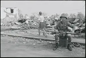 Cholon Prints: Soldier Sitting Amongst Debris and Ruins