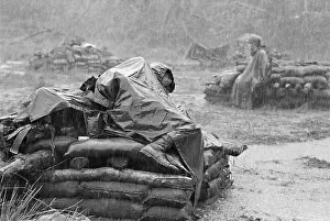 Monsoon Prints: Soldier Sleeping During Downpour in Vietnam