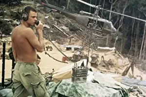 Soldier Talking Into Transmitter on War Scene