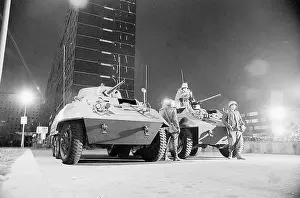 Guarding Prints: Soldiers with Armored Vehicles Watch for Sniper