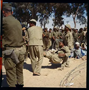 Soldiers Carrying Wounded Man