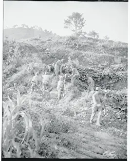 Soldiers Carrying the Wounded Down Terrain