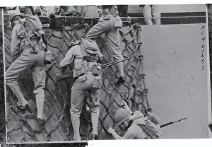 Soldiers Climbing Net on Ship