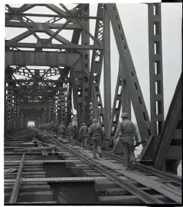 North Korea Prints: Soldiers Cross Railroad Bridge