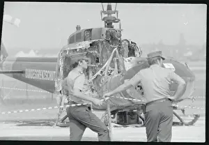 Soldiers by Damaged Helicopter