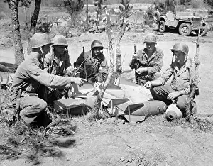 Soldiers Examining Aerial Bombs