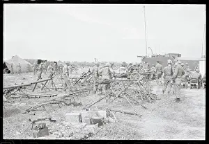 Soldiers Examining Captured Weapons