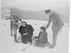 Soldiers Helping Exhausted Women