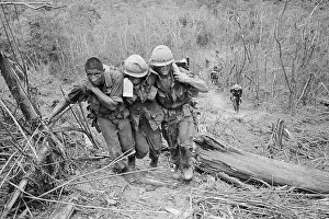 Soldiers Helping Wounded Marine