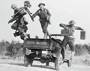 Soldiers Jumping off Back of Vehicle