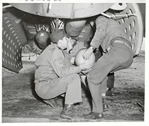Portland Prints: Soldiers Loading Bomb into Bay of Bomber Plane