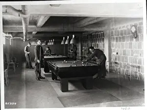 Soldiers Play Billiards In Basement