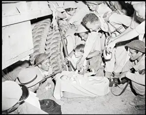 Convoy Prints: Soldiers Playing With Small Baby