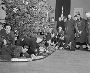 Soldiers Playing with Train Set