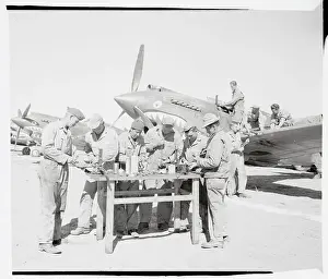 Soldiers Repairing Machine Guns