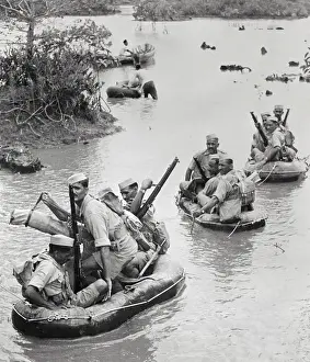 Soldiers Rowing Boat in Water